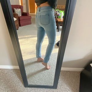 Ripped style light blue jeans.